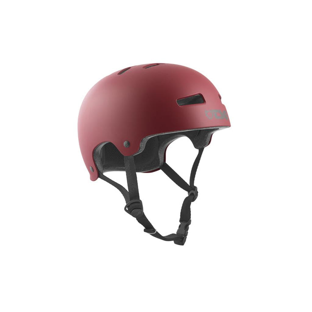 The TSG Evolution Helmet in Satin Oxblood is a slim hardshell helmet with ventilation holes, black adjustable chin strap, foam padding, high-impact protection, and a Tuned Fit System for secure comfort.