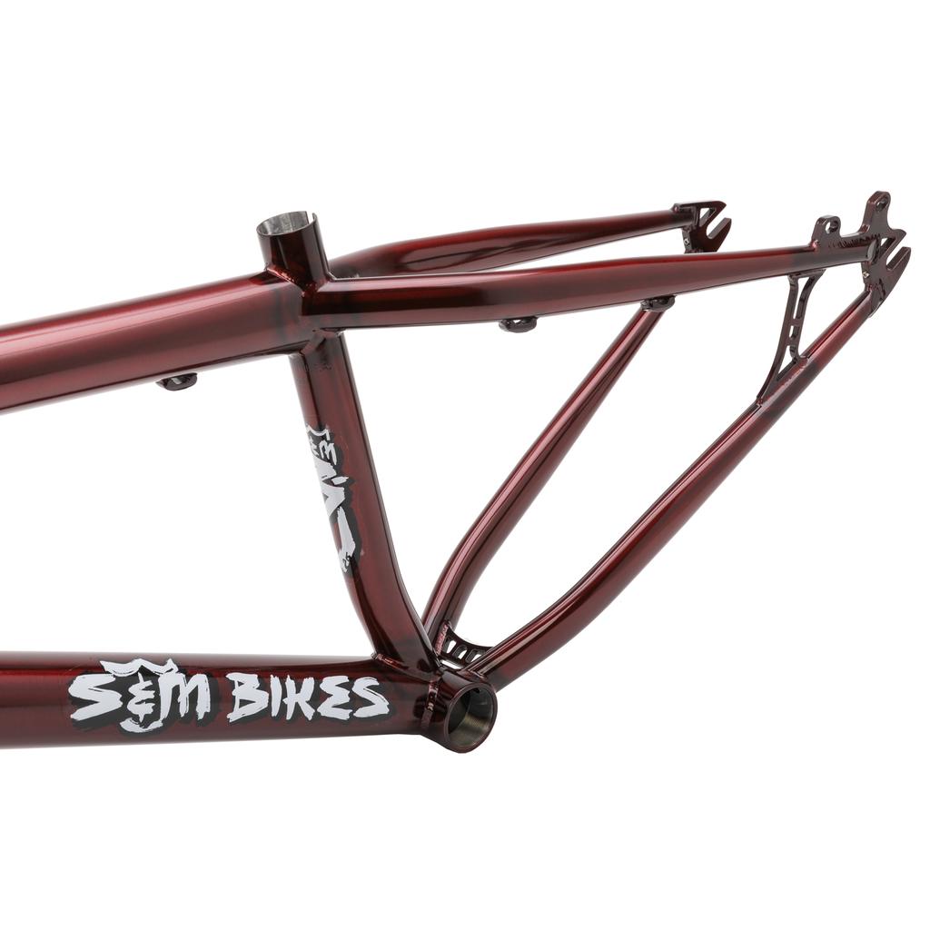 Close-up of the S&M Big Jumper V2 26 Inch Dirt Jumper Frame in metallic red, showcasing the white S&M logo on the downtube—perfect for pairing with your preferred suspension fork or disc brake setup.