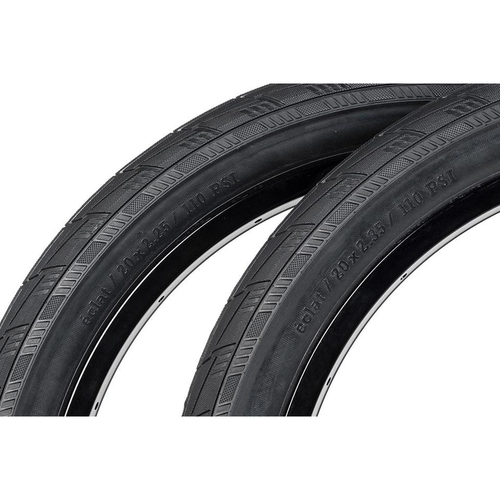 The Eclat Mirage Wire Bead Tyre (Each) features a sleek black design with visible tread and sidewall specs, ideal for street riders seeking a high-performance BMX tire.