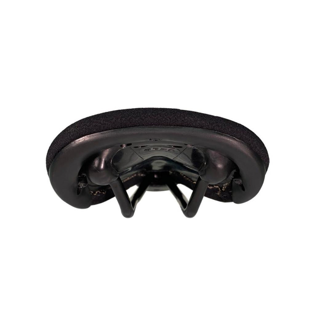 Close-up view of the underside of the S&M Shield Kevlar Railed Seat showing its black finish, cro-mo rails, and padding.