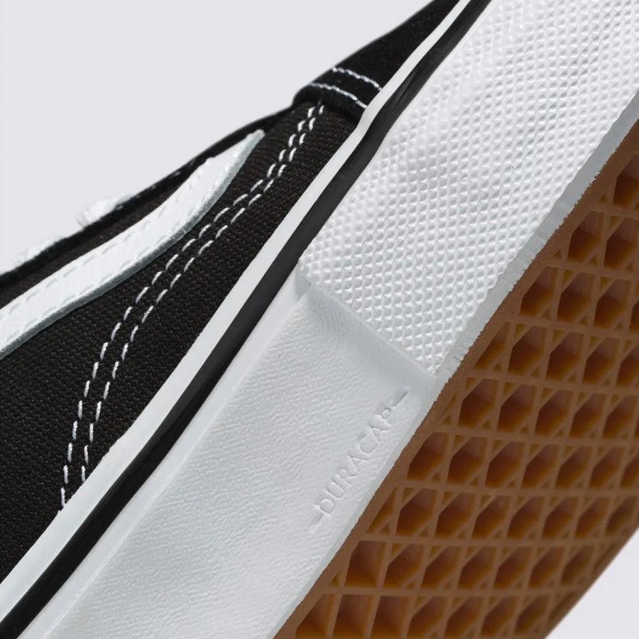 Close-up of a Vans Skate Old Skool Shoes - Black/White sneaker featuring the textured sole, white toe cap, and stitched details.