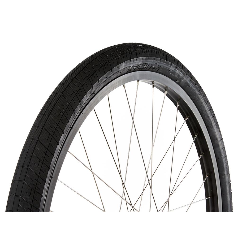 Close-up of the S&M Covid 26 Inch Wheel Set featuring a black tire, metal spokes, double wall rims, and a silver flip-flop hub set against a white background.