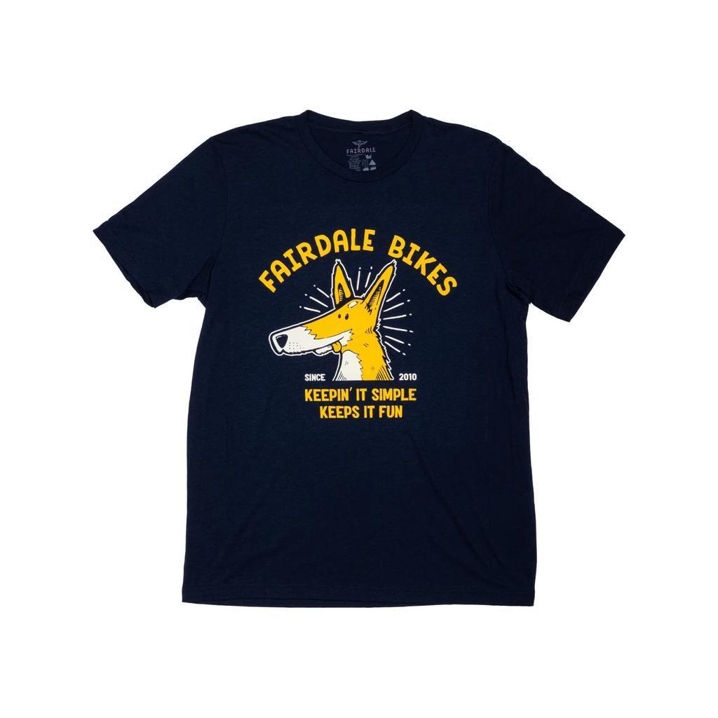 The Fairdale Simple Monty T-Shirt is a navy blue tee featuring a cartoon dog head and "FAIRDALE BIKES" with the slogan "Keepin' It Simple Keeps It Fun Since 2010" in yellow and white—an ideal pick for sharing good vibes.