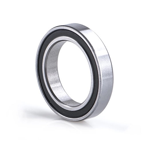 A close-up of a 6805 Sealed Bearing 25x37x7 with a black rubber seal, standing upright on a white background.