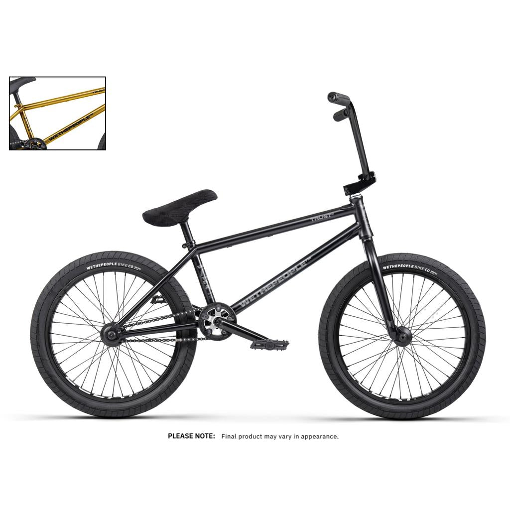 A black street BMX bike with thick tires, a padded seat, and upright handlebars is displayed on a white background; an inset highlights the gold Wethepeople Trust 20 Inch Freecoaster/Hybrid Bike.