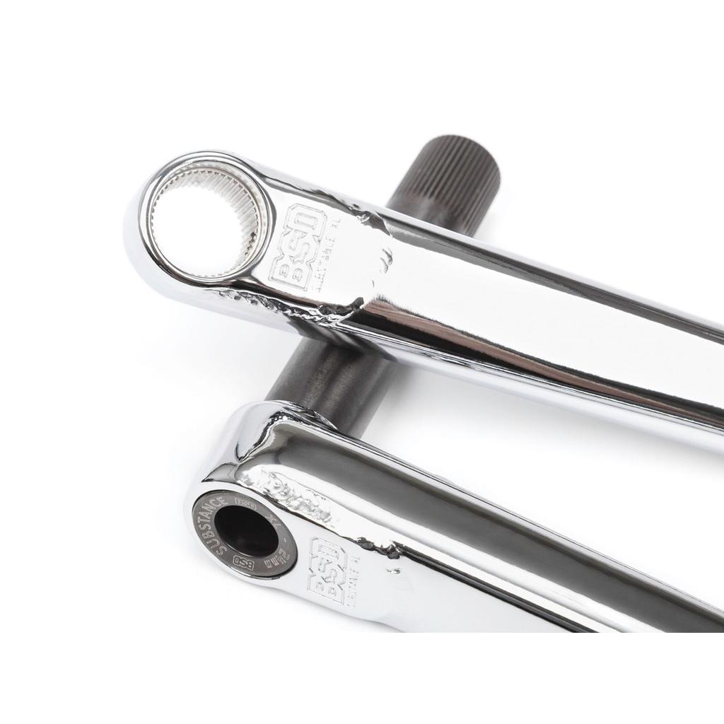 A pair of chrome BMX crank arms with BSD branding, intersecting via a 24mm hollow spindle partially inserted—ideal for anyone upgrading to BSD Substance XL V2 Cranks.