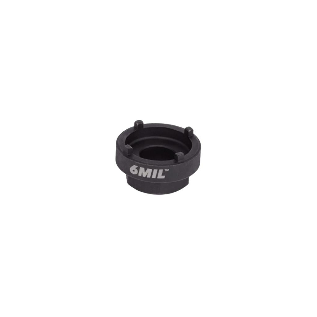 The 6MIL Freewheel Removal Tool (14T) is a black, circular metal tool with four prongs and "6MIL" printed on the side, ideal for BMX freewheel removal. Shown on a plain white background.