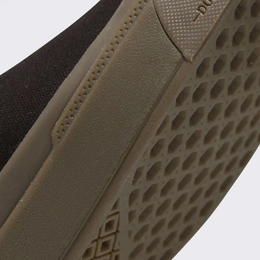 A close up of the sole of a black and brown Vans BMX Slip On Shoes (Dennis Enarson) Black/Multi shoe.