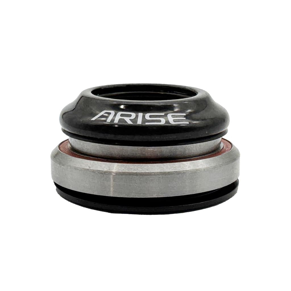 A close-up of an Arise Crystal 8 Tapered Headset, showing its metal and black integrated design with "ARISE" printed on the carbon fibre top cap.