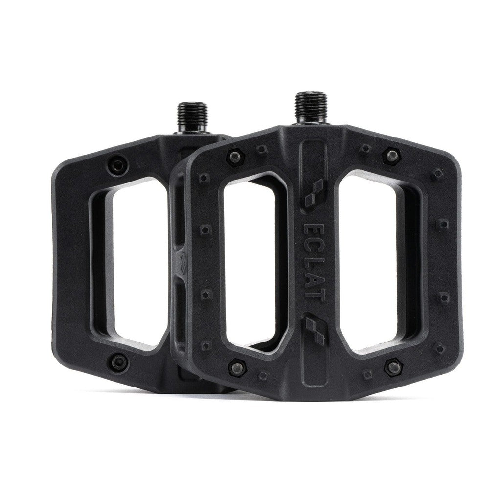 A pair of black Juggernaut Pedals on a white background.