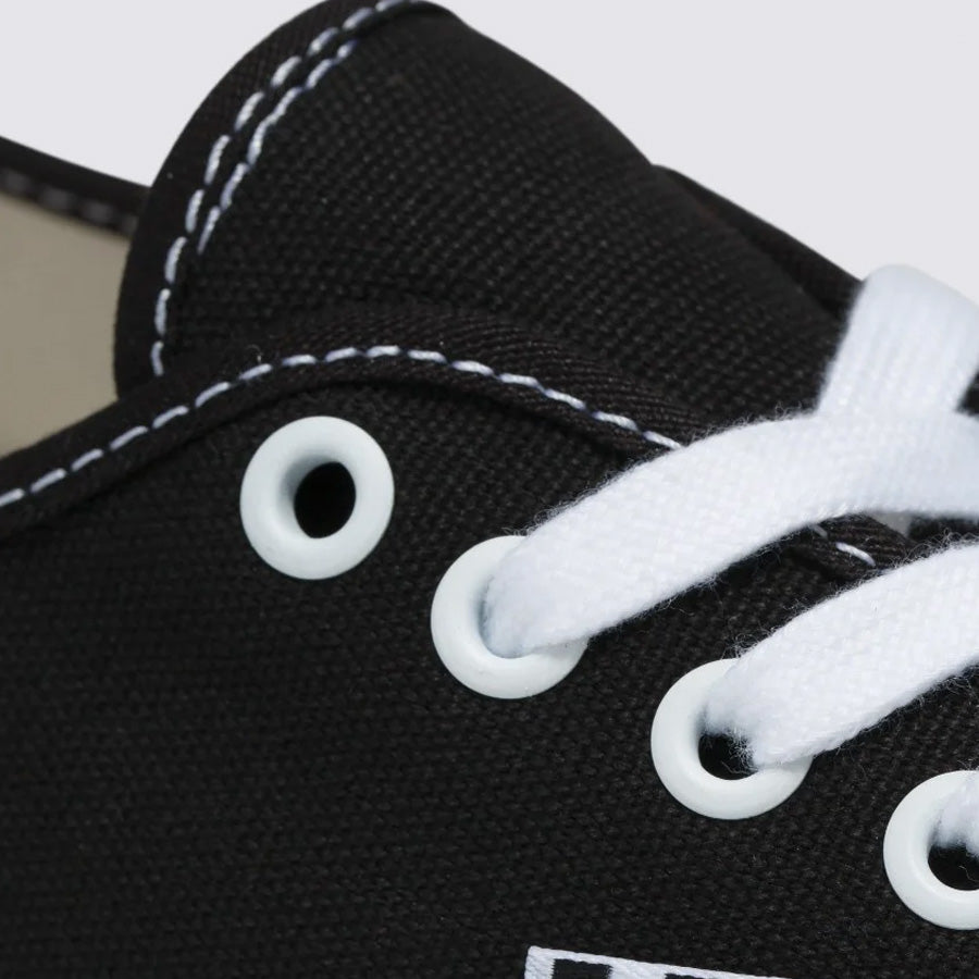A close up of a Vans Pro Skate Classics Authentic - Black/White sneaker with white laces.