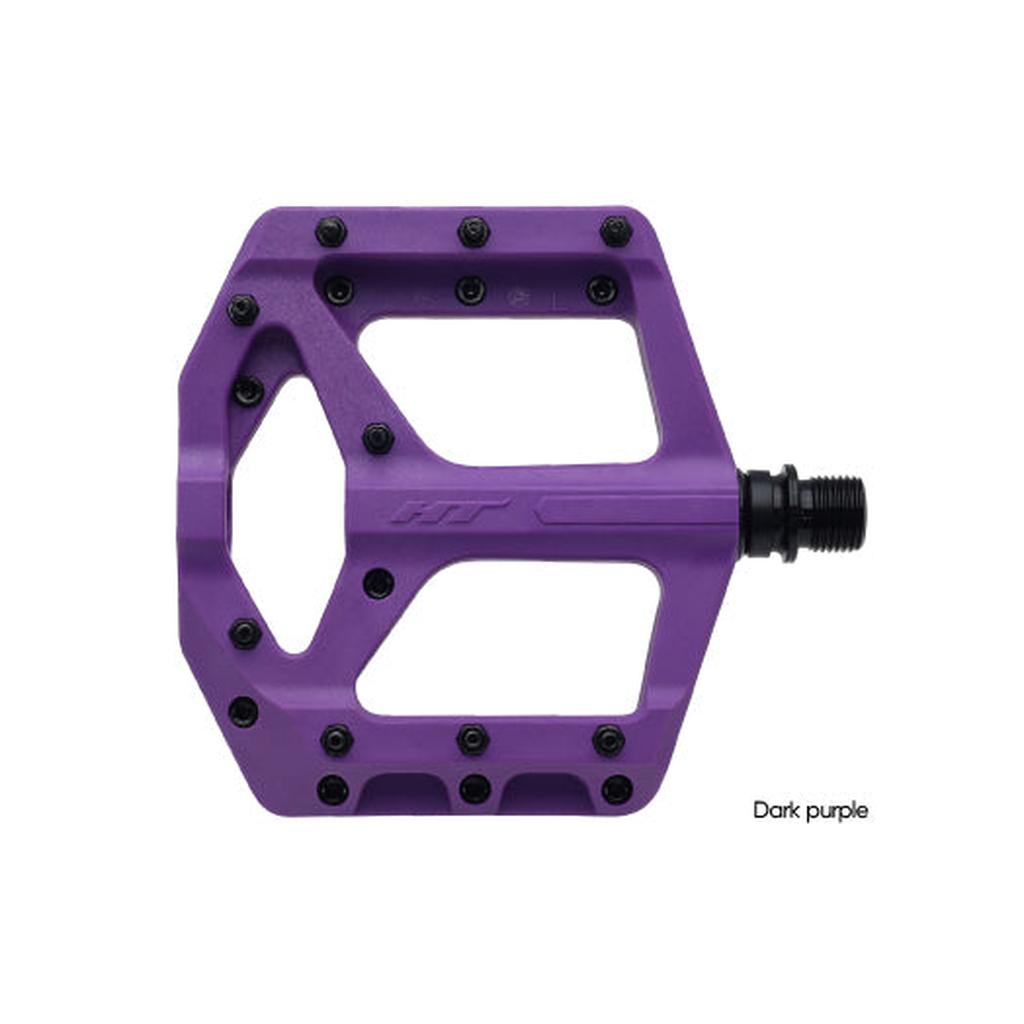The HT Components Supreme C PA32A Pedals are dark purple flat pedals with replaceable grip pins and a black axle, designed for traction, shown against a white background.