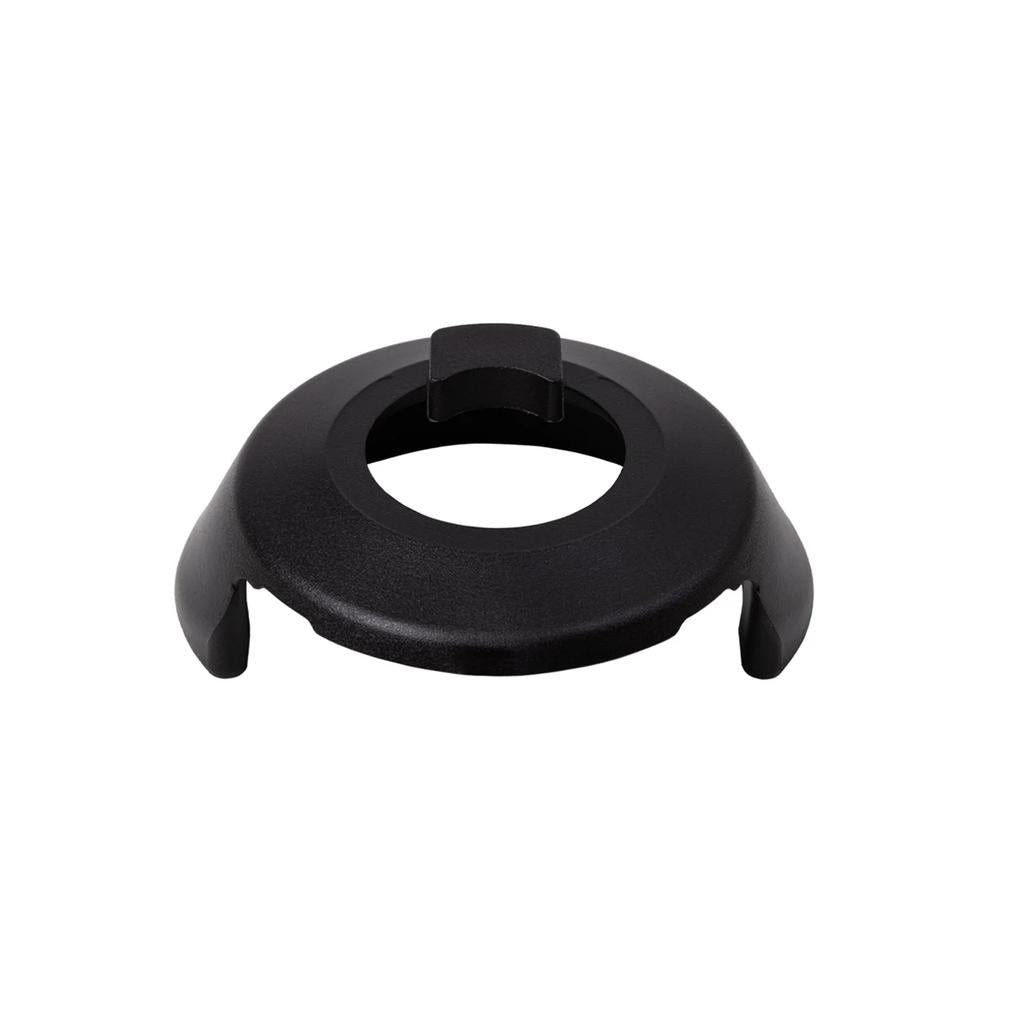 The Odyssey Clutch Pro Hub Guard (Drive Side) features a black proprietary plastic mounting base with a central circular opening, three raised support sections, and a press-fit design for use with the Odyssey Clutch Pro Freecoaster.