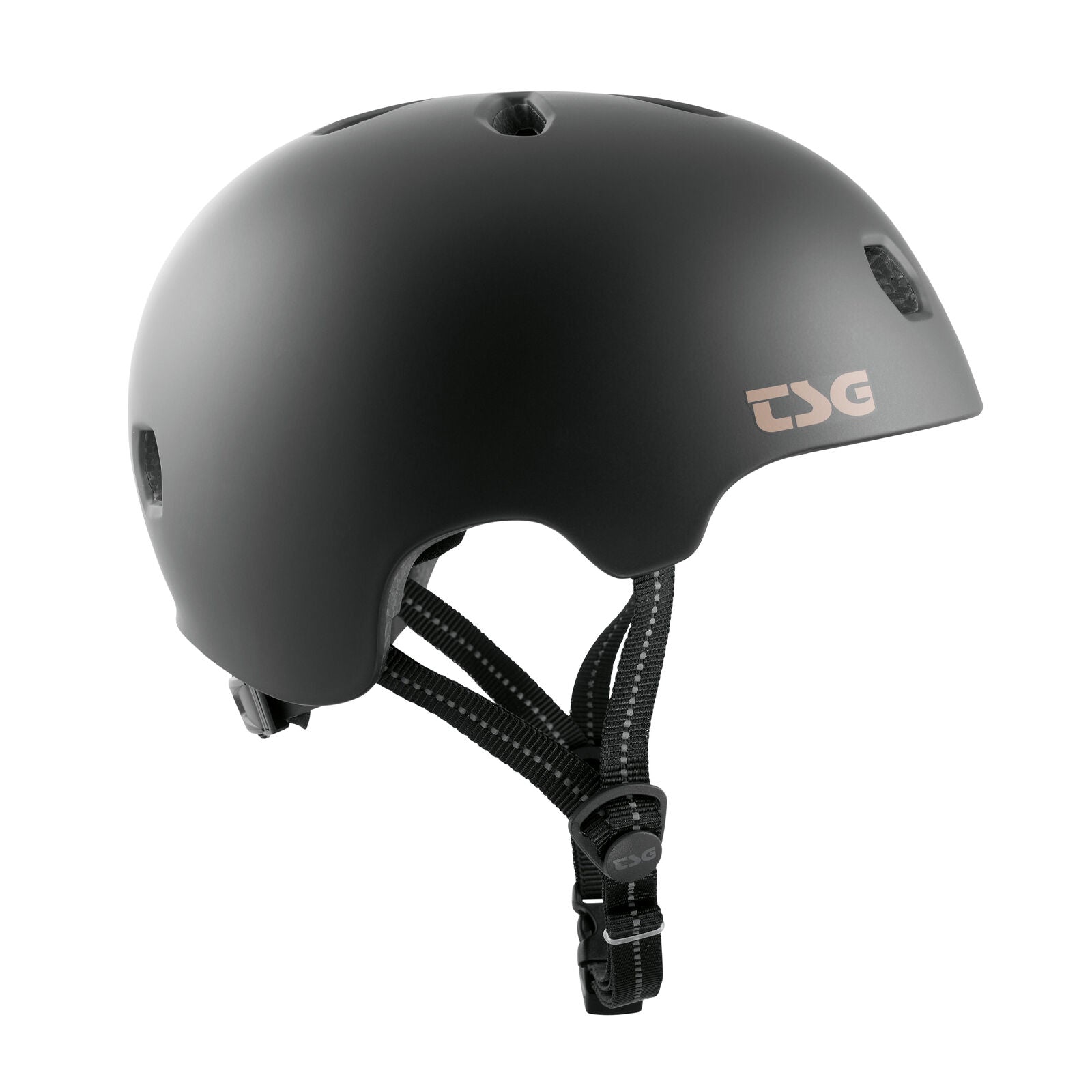 The TSG Meta Helmet Satin Black features ventilation holes, lightweight in-mold construction, and an adjustable chin strap, shown from the left side.