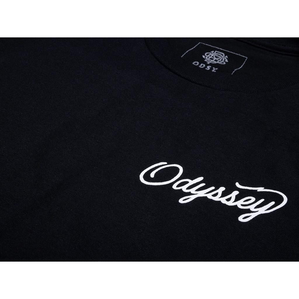 Close-up of the Odyssey DOF Script Long Sleeve T-Shirt in black, featuring “Odyssey” in white script on the front and a small “ODSY” logo on the inner neckline, blending winter style with freestyle flair.