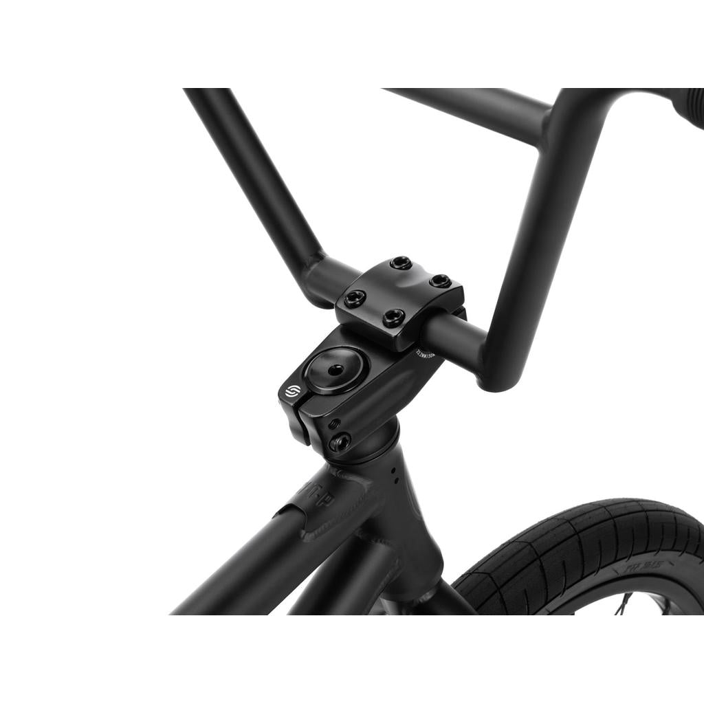 Close-up view of the Wethepeople Reason Shift 20 Inch Bike’s full chromoly handlebar and stem, showing their connection to the front frame and part of the front tire, set against a white background.