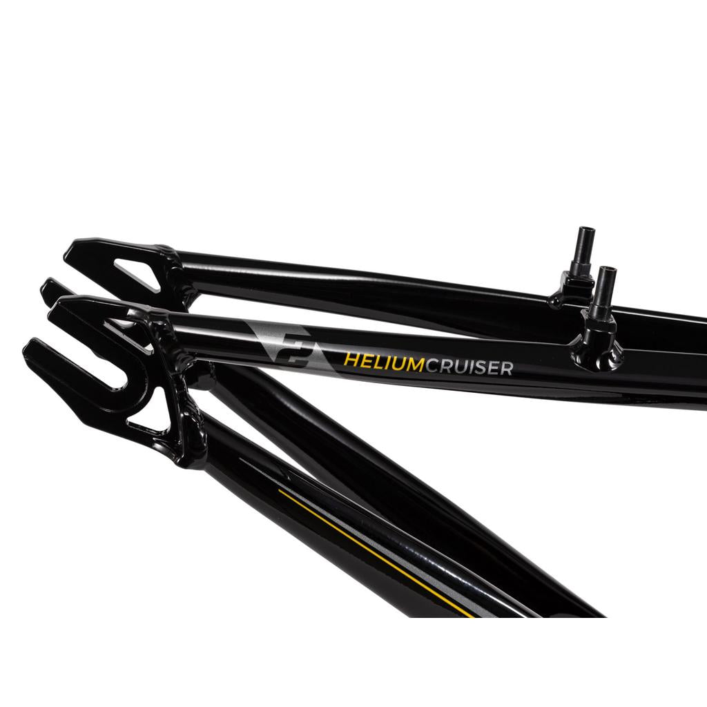 Close-up of a black Radio Raceline Helium Cruiser 24 Frame, made from hydroformed 6061 alloy, featuring "HELIUM CRUISER" text, logo, rear triangle details, and disc brake compatible dropouts.