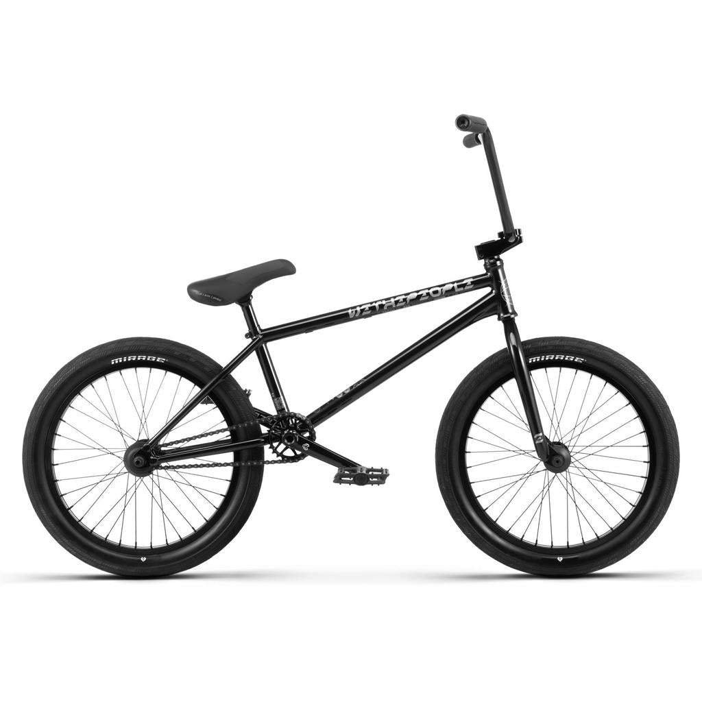The Wethepeople Envy 20 Inch Bike is shown from the side on a white background, featuring a black finish, thick tires, padded seat, straight handlebars, and a durable Chromoly frame for enhanced performance.