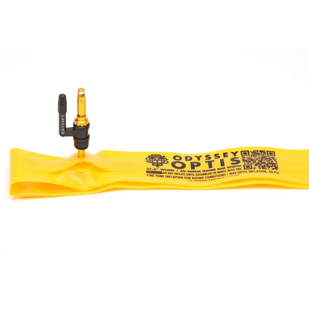 A yellow Odyssey OPTIS Insert With Valve P/V Tube (27.5 Inch) with a black and gold Presta valve is shown laying flat on a white background.