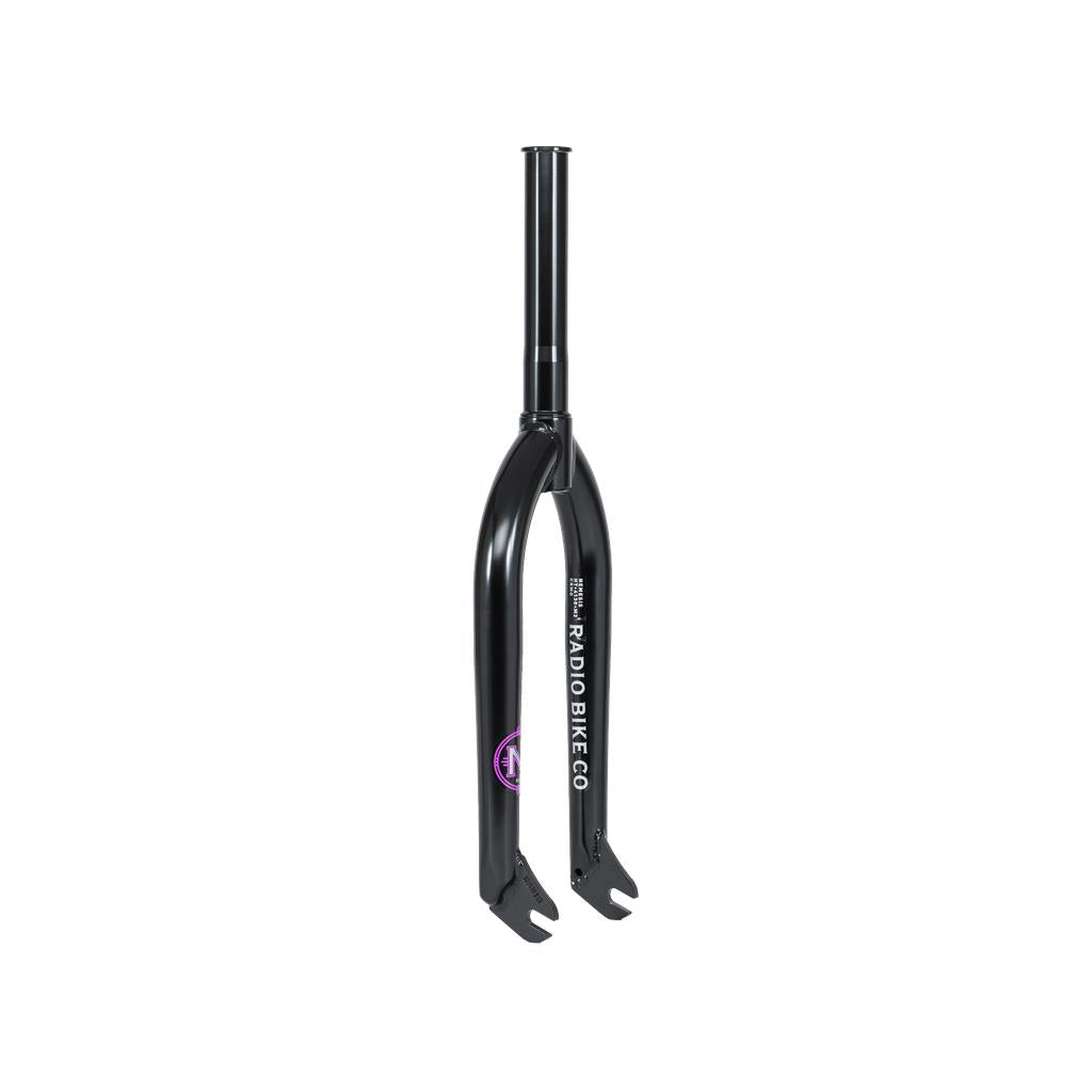 Radio Nemesis Forks with "RADIO BIKE CO" branding and a purple sticker, made from heat-treated chromoly for a responsive front end, shown on a transparent background.