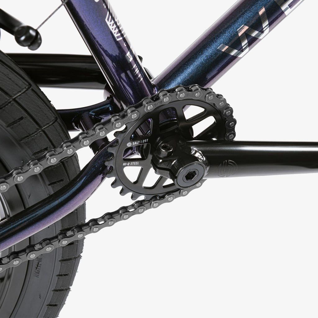 A close up of a purple Wethepeople CRS 20 Inch Bike with Eclat Surge Pedals.