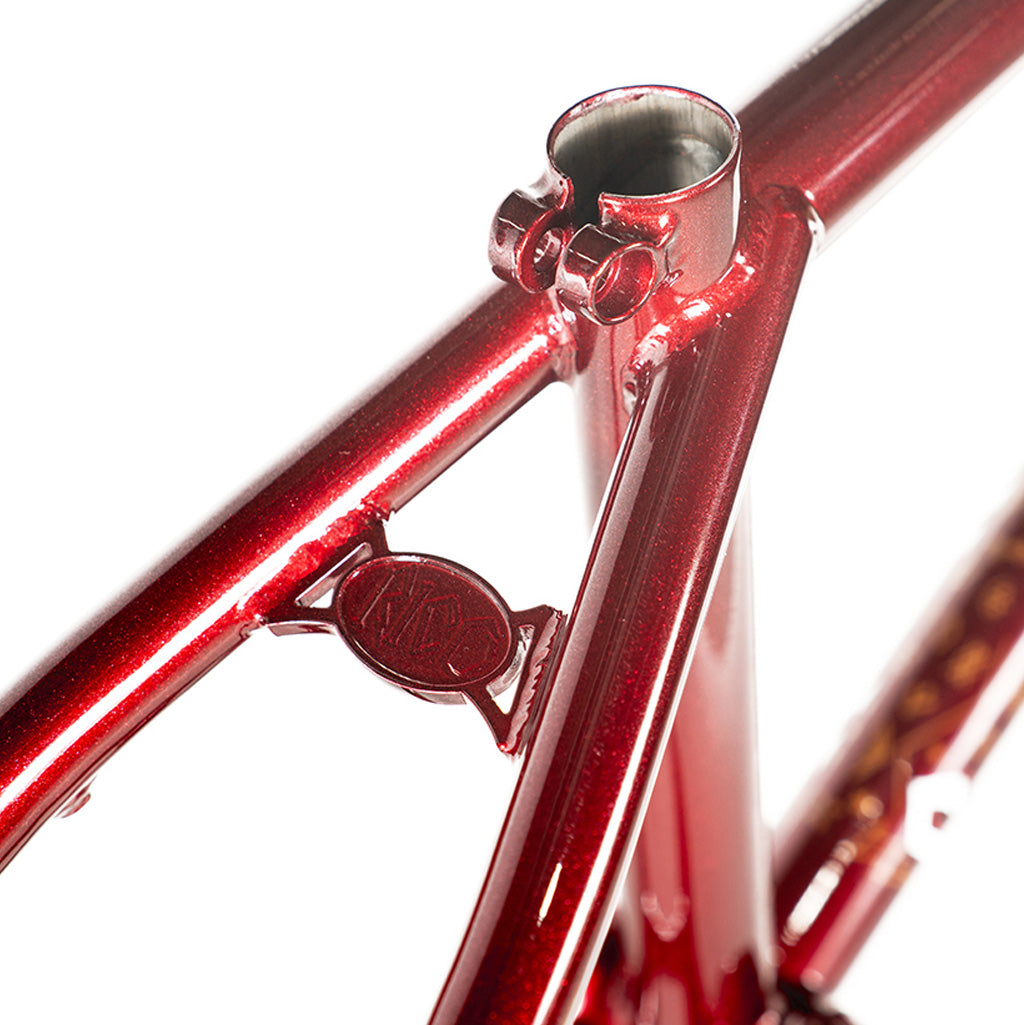 A close up of the Colony Rico 'Lite' Frame, a red bicycle frame designed by Paterico Fallico, the technical wizard.