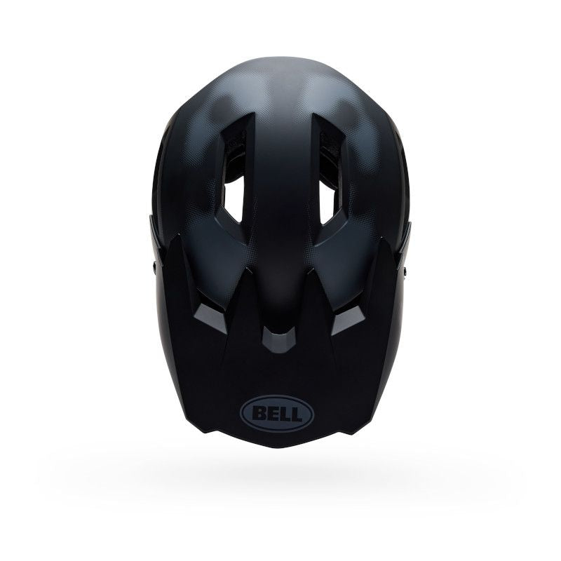 The Bell Sanction 2 DLX MIPS Camo Matte Black helmet is shown from the front, displaying three elongated vents and a matte finish for a lightweight feel.