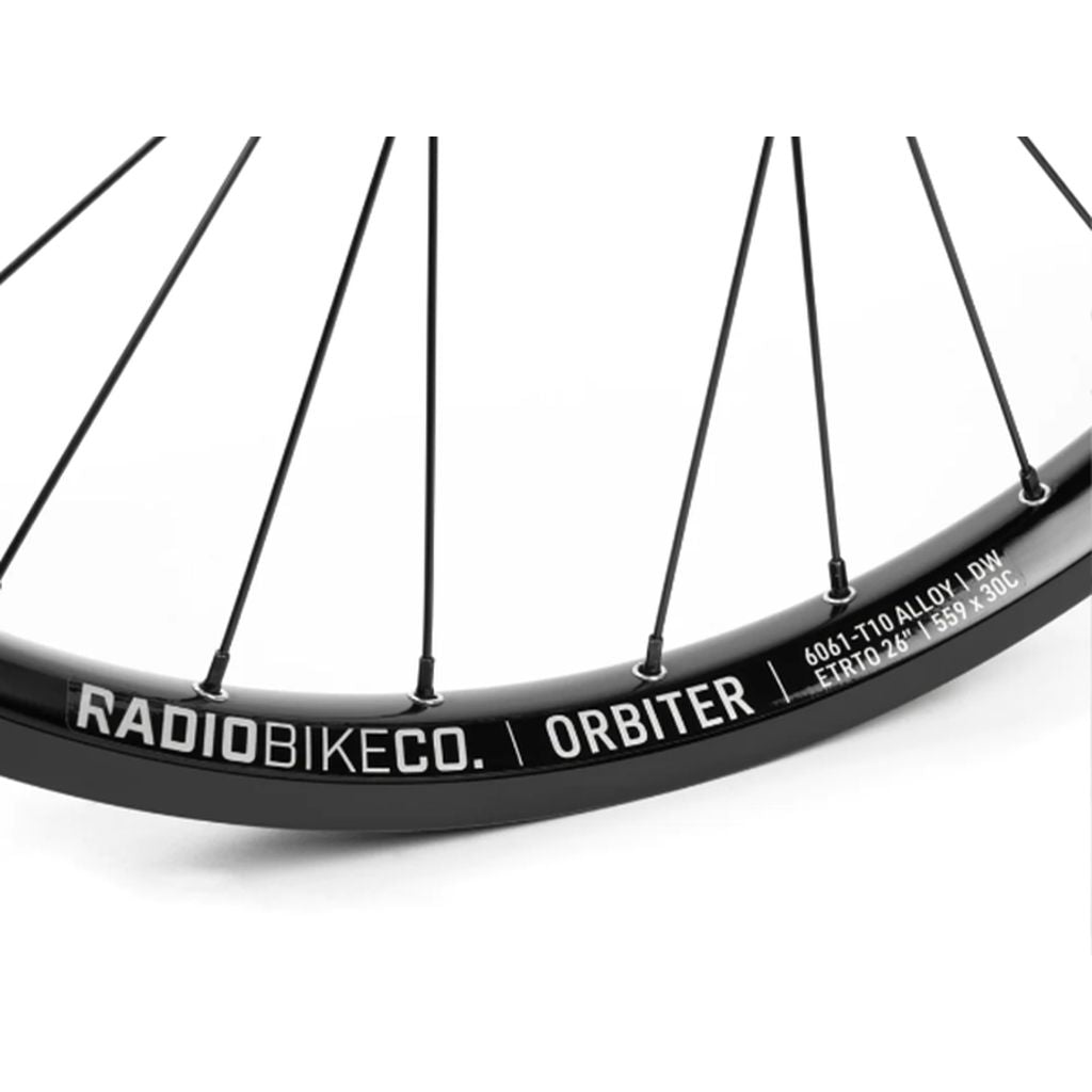 Close-up of a Radio Orbiter/Sonar 26 Inch Hybrid Cassette/Freecoaster Rear Wheel labeled "radiobikeco. orbiter street rims" with spoke details, isolated on a white background.