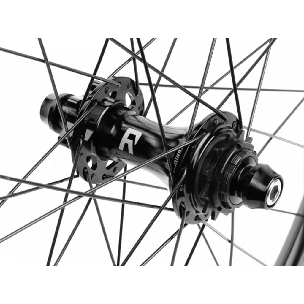 Close-up of a black Radio Orbiter/Sonar 26 Inch Hybrid Cassette/Freecoaster Rear Wheel hub with intricate spokes on a white background.
