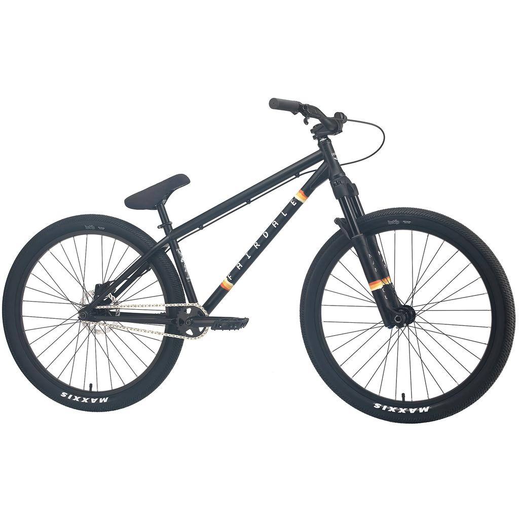 The Fairdale Hareraiser FX 26 Inch Bike is a black hardtail dirt jump bike with a DJ frame, front suspension, single gear, flat pedals, 4130 chromoly build, and Maxxis tires, shown in profile on a white background.