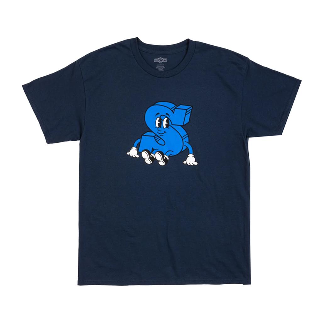 The Sunday S-Man T-Shirt is a navy blue tee featuring a playful S fella—a blue dollar sign cartoon character with eyes, hands, and feet.