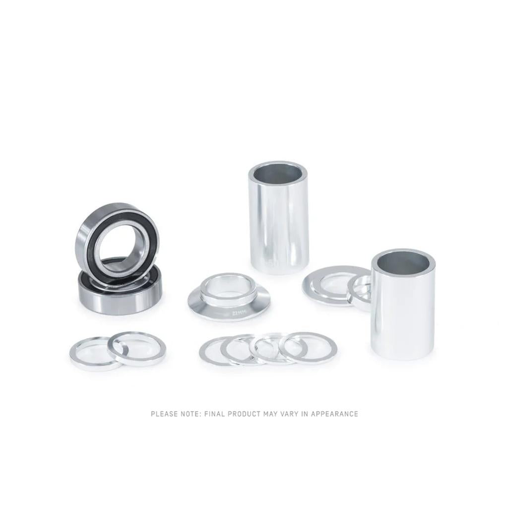 The Eclat Spanish Bottom Bracket includes stainless bearings, cylindrical spacers, and washers, all components for Spanish bottom bracket systems, displayed on a white background.