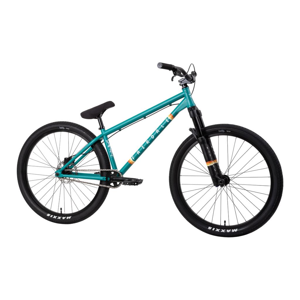 The Fairdale Hareraiser FX 26 Inch Bike, a teal BMX dirt jump model with a 26" DJ frame, single speed, front suspension, flat handlebars, black saddle, and Maxxis tires, is displayed against a white background.