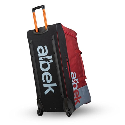The Albek Meridian Wheeled Gear Bag features a large design with wheels, an extendable orange handle, bold "abek" branding on the black side, and a waterproof lining to protect your essentials.