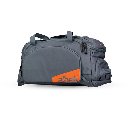 A gray Albek Skytrail 51 Gear Bag with black zippers, side pockets, an orange "abek" logo on the front, and a padded helmet compartment for protection.