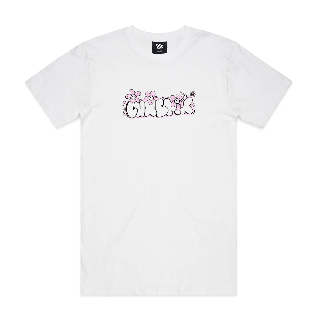 The LUXBMX Ali Tee - White features “UNDEFEATED” in bubble letters, a floral pattern with pink flowers and a bee above the print. Made from breathable cotton, this tee offers standout Alirah Norris style and comfort.
