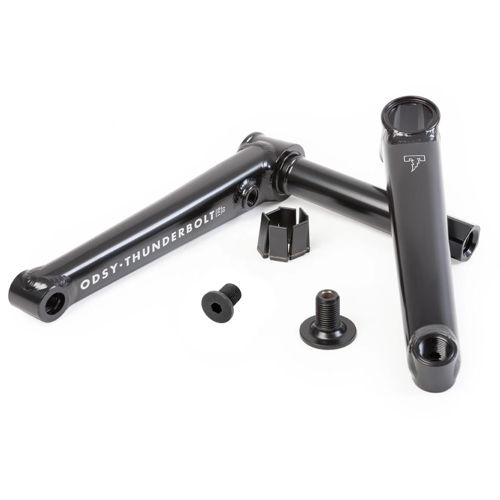 A pair of black Odyssey Thunderbolt DJ Cranks, crafted from 41-Thermal heat-treated material, with bolts and a bottom bracket dust cap, are shown on a white background.
