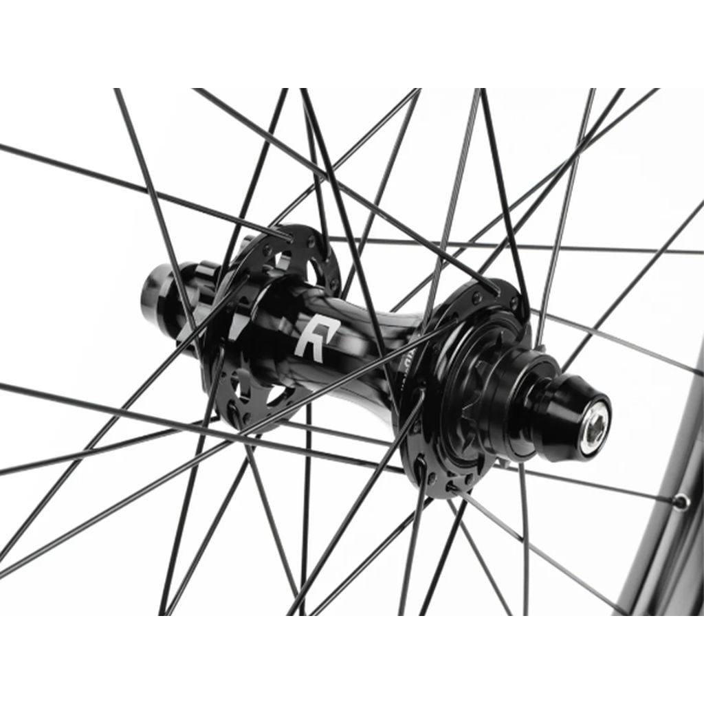 Close-up of a black Radio Orbiter/Sonar 26 Inch Hybrid Cassette/Freecoaster Rear Wheel hub and spokes intricately connected, focusing on engineering details.
