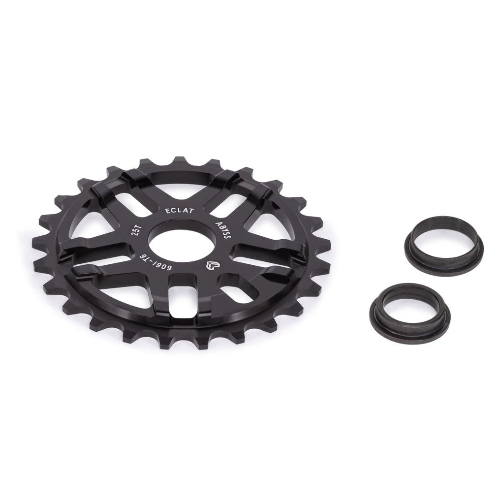 The Eclat Abyss Sprocket, made from 6061-T6 alloy for BMX bikes, features 25 teeth and comes with two black spacers. The sprocket is shown in black metal on a white background, labeled "Eclat Adjust.