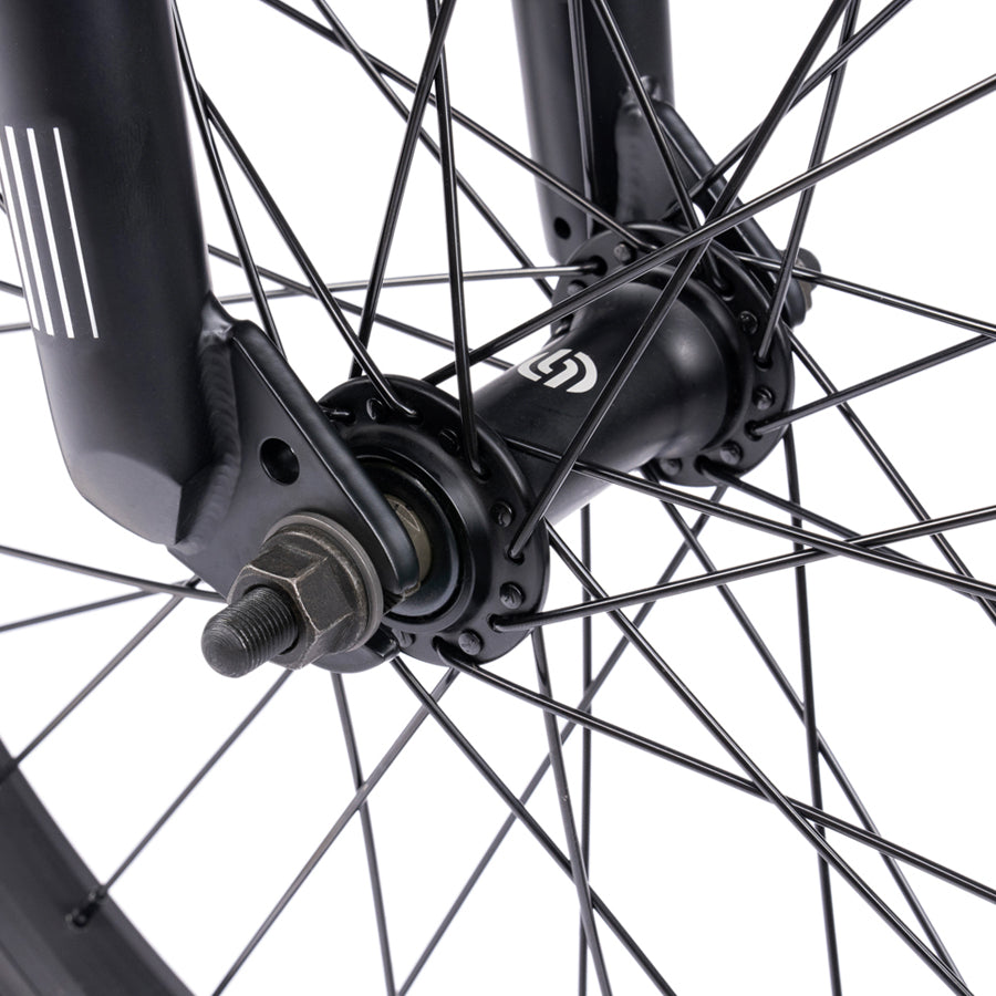 A close up of the Wethepeople Nova 20 Inch BMX Bike on a black bike wheel.
