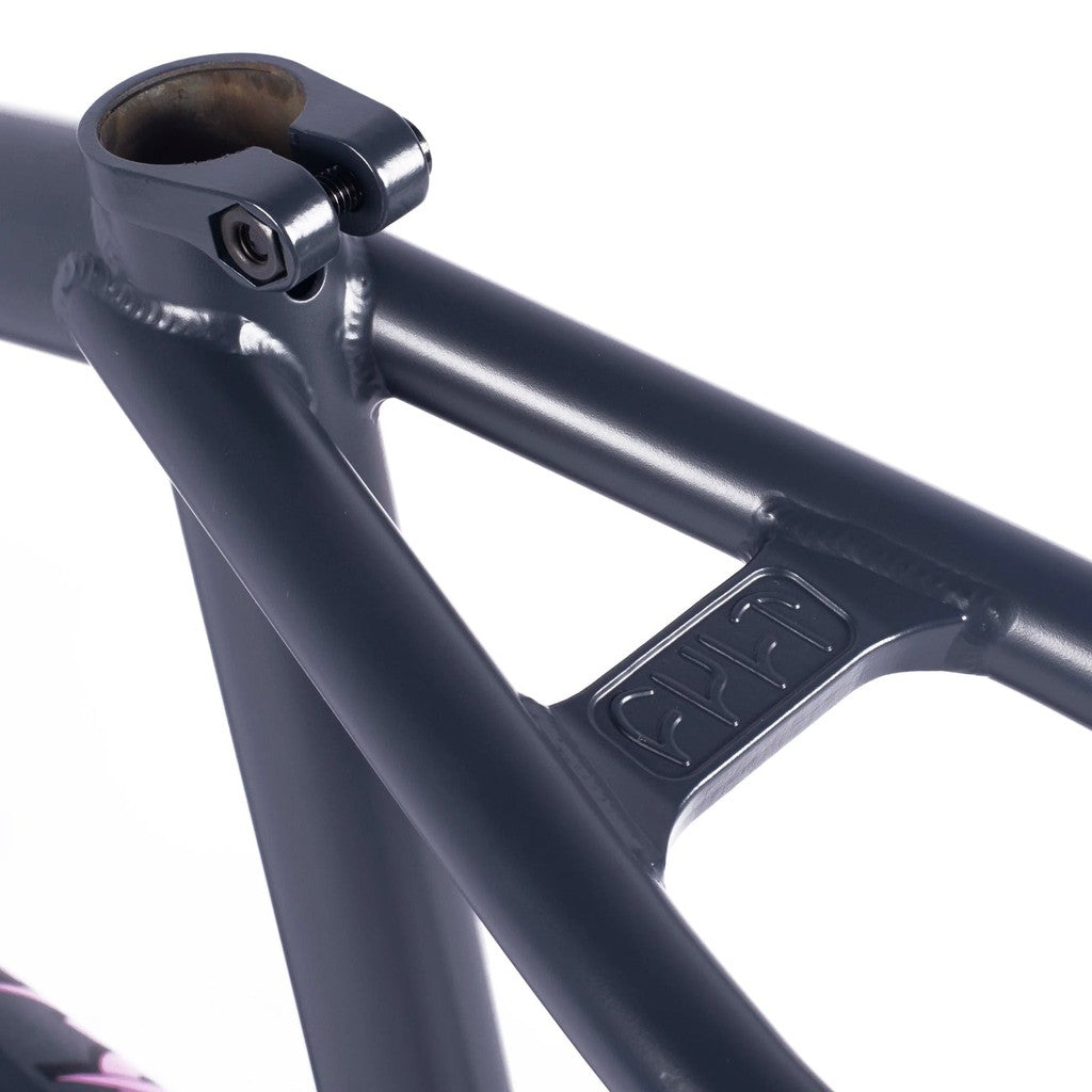 A close up of a Gun Metal coloured bike frame with pink accents, known as the Cult Crew Frame (Jaume Sintes Signature).