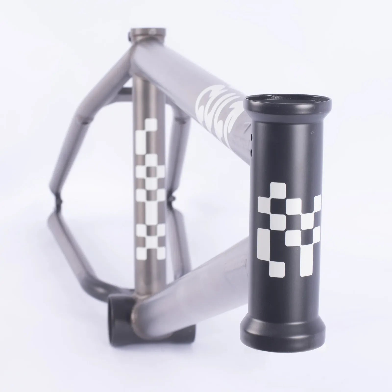 The Cult Shorty Killian Roth V2 Frame in matte gray features white geometric square patterns on the head tube and down tube, shown against a white background.