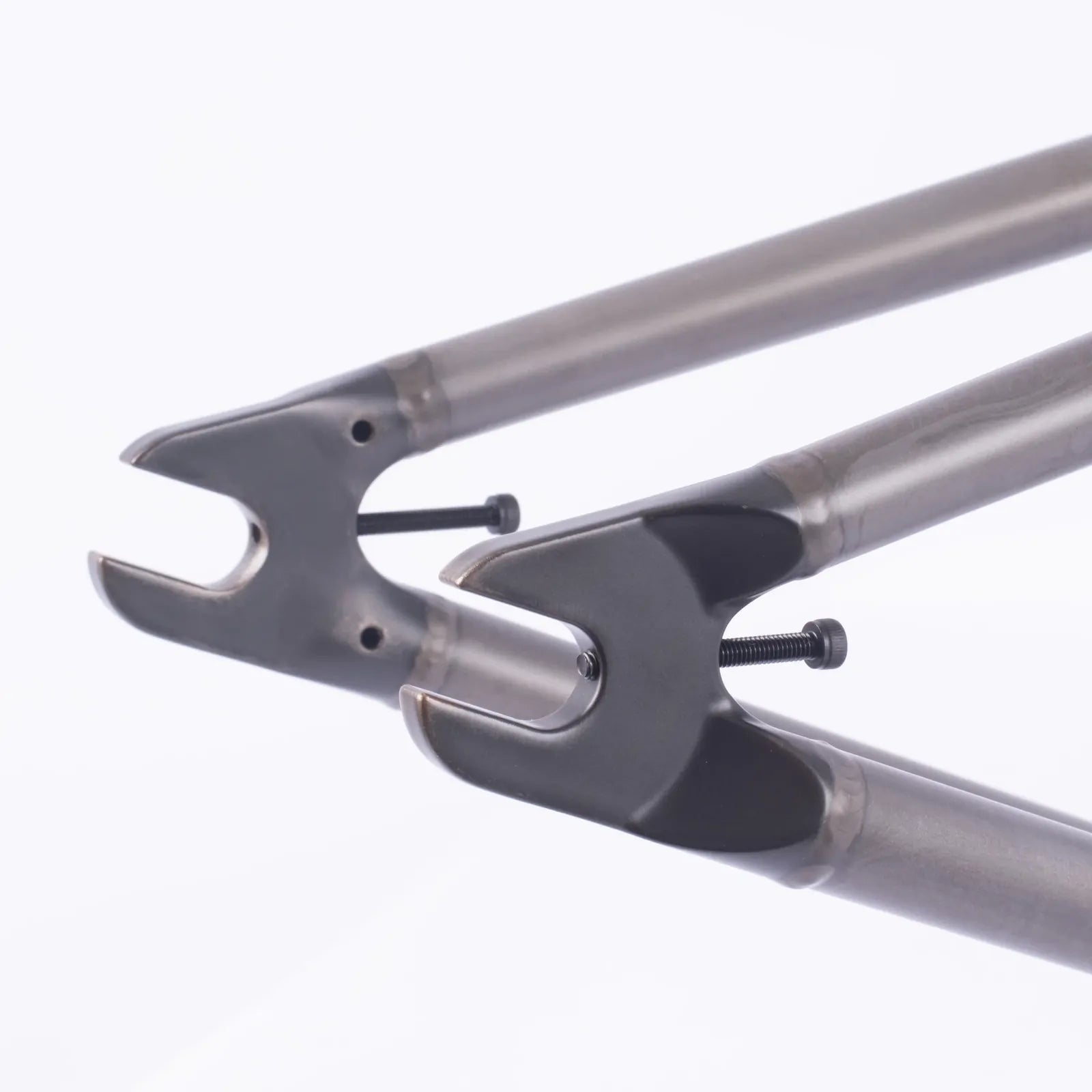 Close-up view of metal dropouts with bolts on a plain white background—ideal for showcasing the precision engineering of the Cult Shorty Killian Roth V2 Frame.