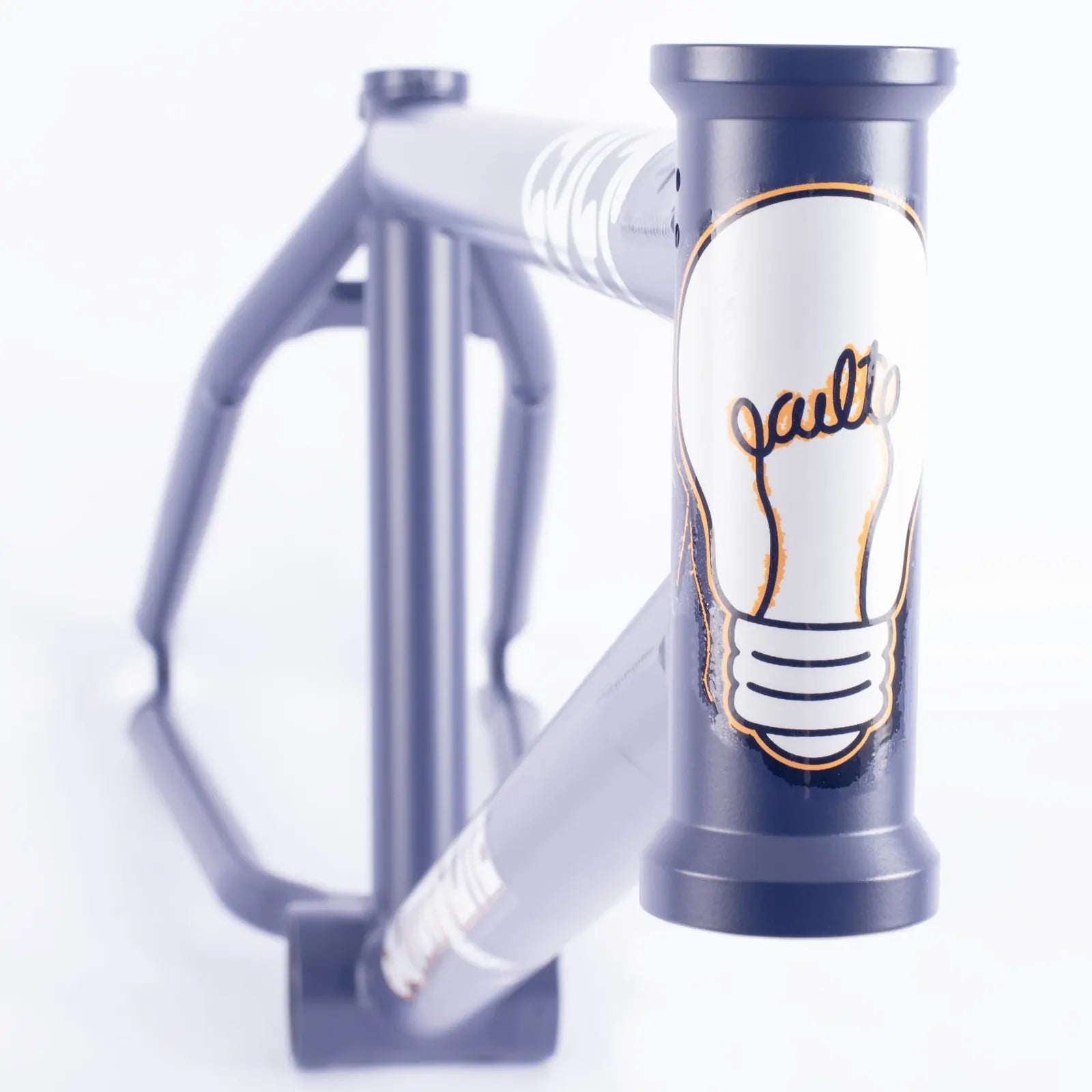 A close-up of the Cult Shorty V2 Sumn Lite Frame in the Eddie Cuellar Colourway, highlighting a white and gold light bulb graphic with “vault” on the front tube—a standout detail for any street BMX enthusiast.