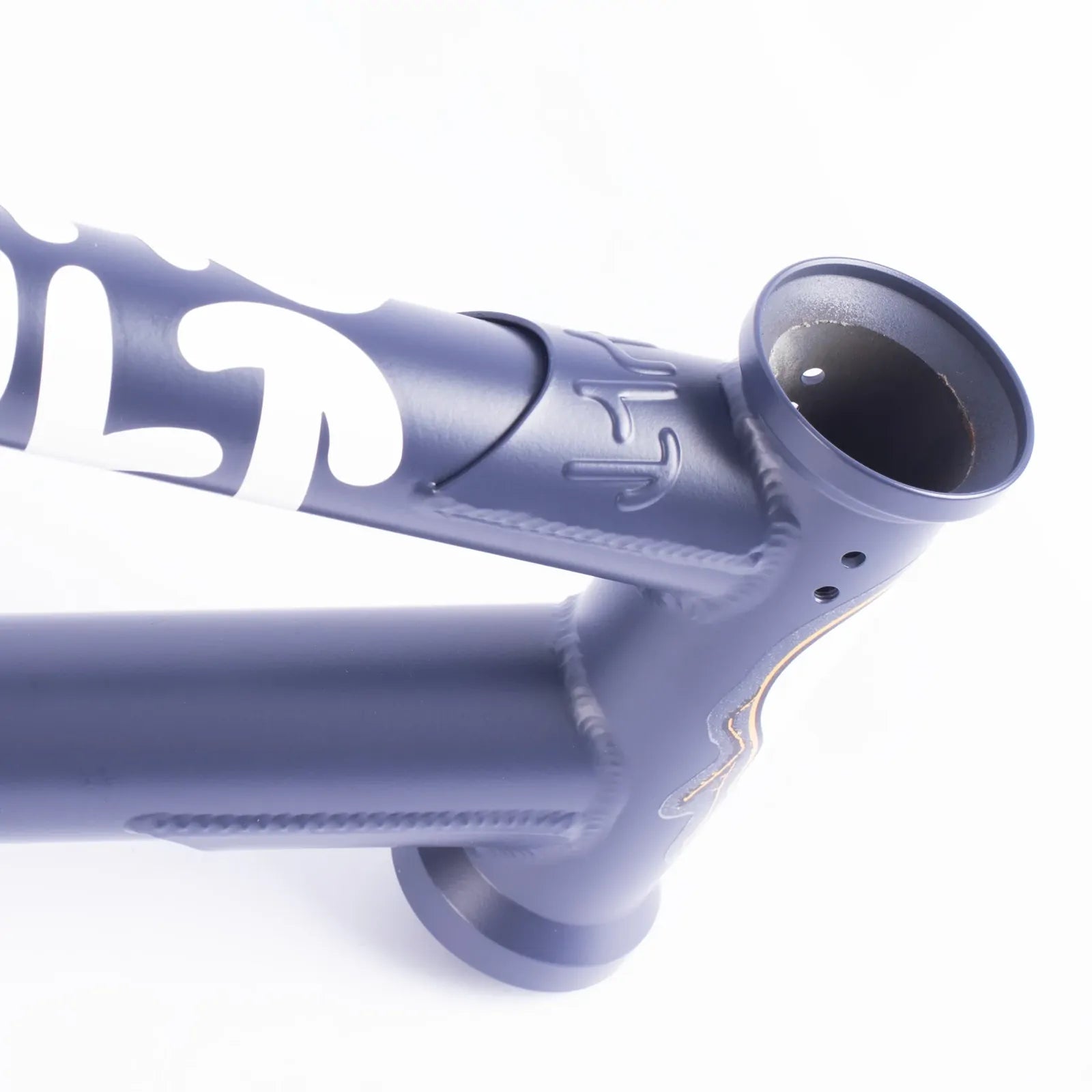 Close-up of the Cult Shorty V2 Sumn Lite Frame in Eddie Cuellar Colourway, showcasing the matte blue finish, head tube, top tube, down tube, welded joints, and bold graphic lettering.