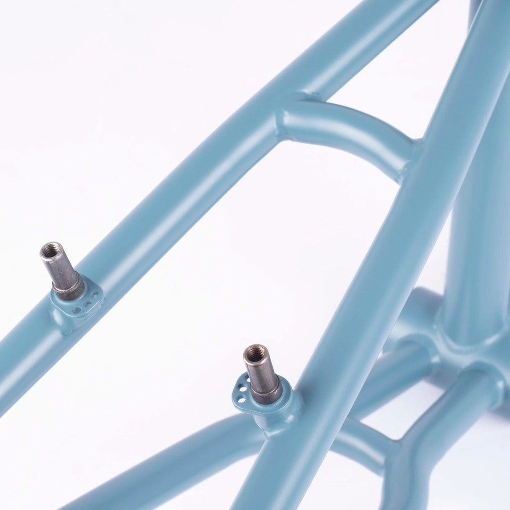 A close up of a light blue Cult Vick Behm Race Frame, showcasing its strength and featuring the Vick Behm signature.