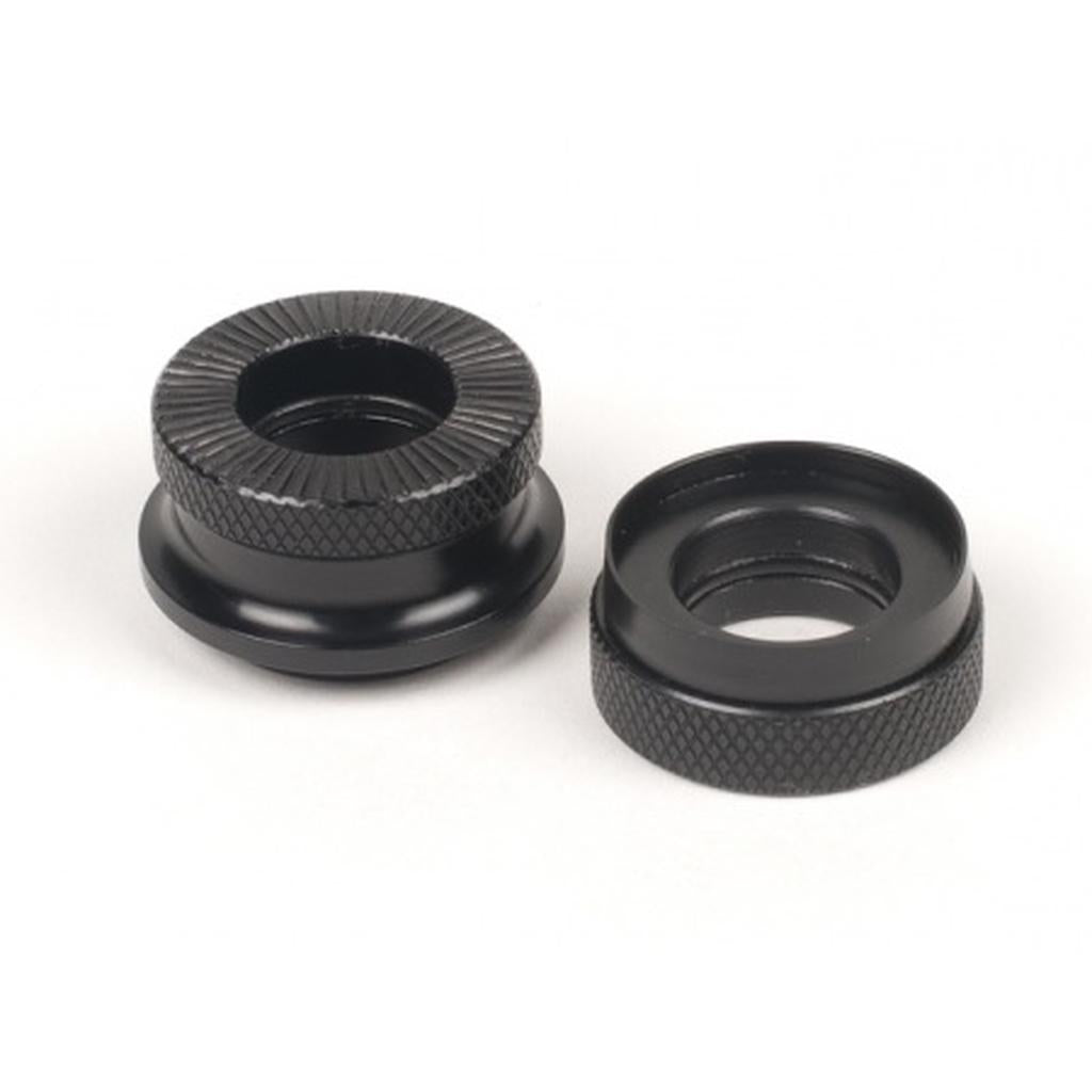 The Eclat Kolibri Cone Set includes two black, round metal knurled thumb nuts with textured edges, perfect as replacement cones or bike hub parts for your Kolibri rear hub, shown side by side on a white background.