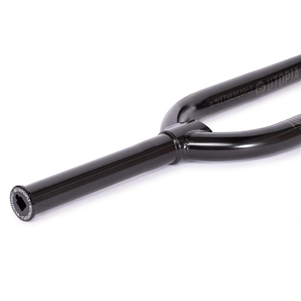 Close-up of Wethepeople Utopia Flatland Forks (10mm Offset), lightweight BMX forks with a black metal finish and hexagonal socket on the end of the steerer tube, shown against a white background.