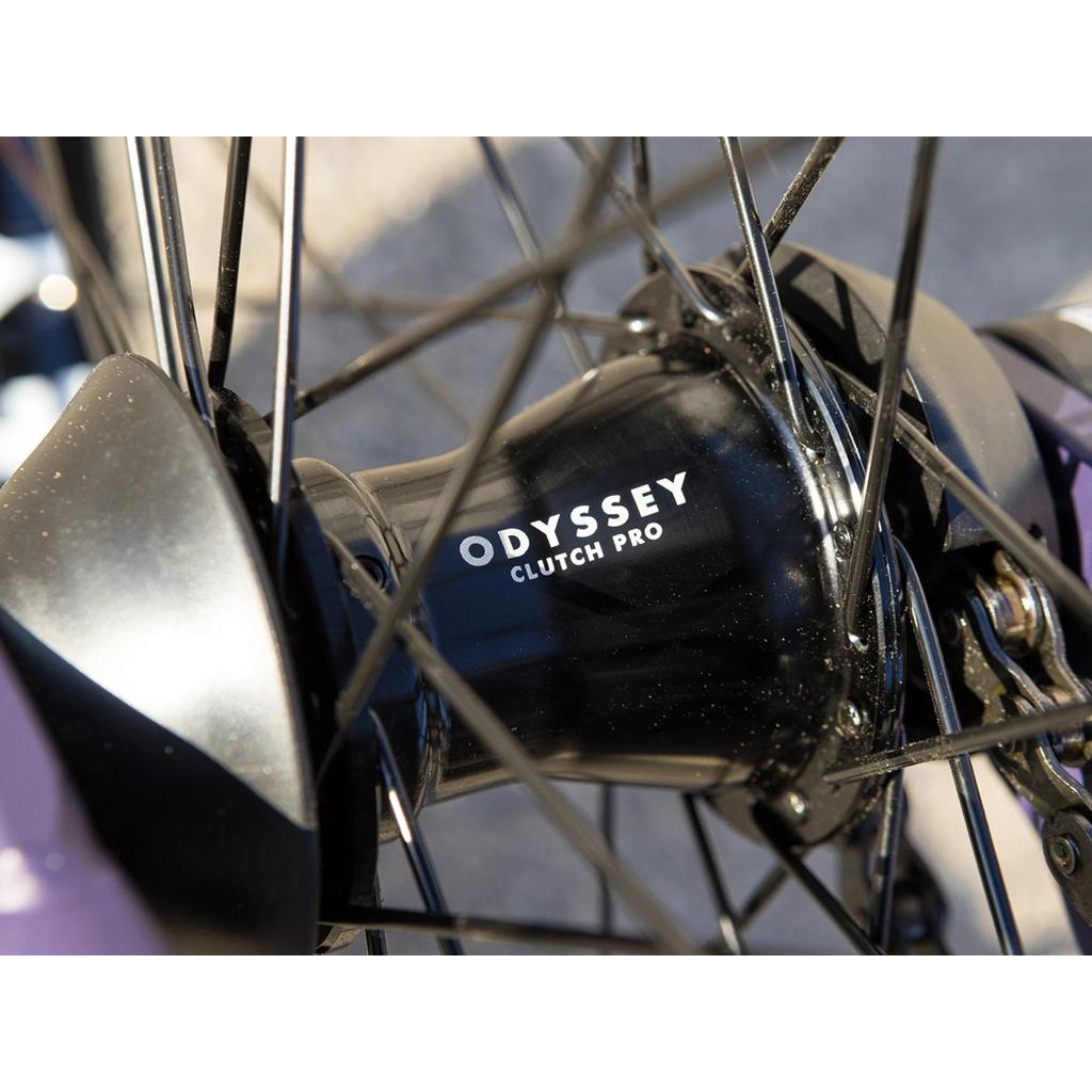 Close-up of a bicycle wheel hub labeled "Odyssey Clutch Pro" with black spokes, featured on the Sunday Dark Wave Authentic 20 Inch Bike—a Broc Raiford signature model with a 100% Chromoly frame.