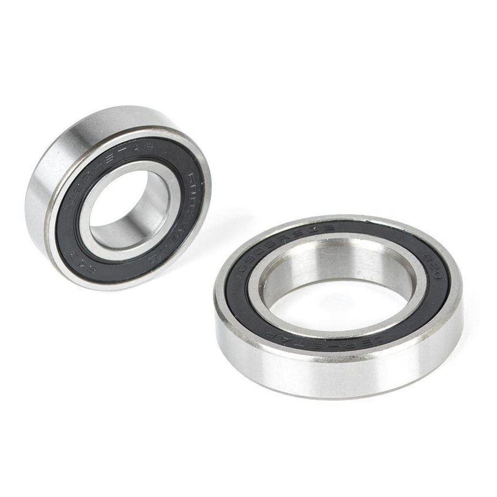 The ECLAT Cortex CS Hub Bearing Set, featuring two metal bearings with black inner seals, is displayed on a white background—one flat and one standing on its edge.